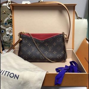Louis Vuitton Pallas cherry clutch with removable straps. This style is retired.